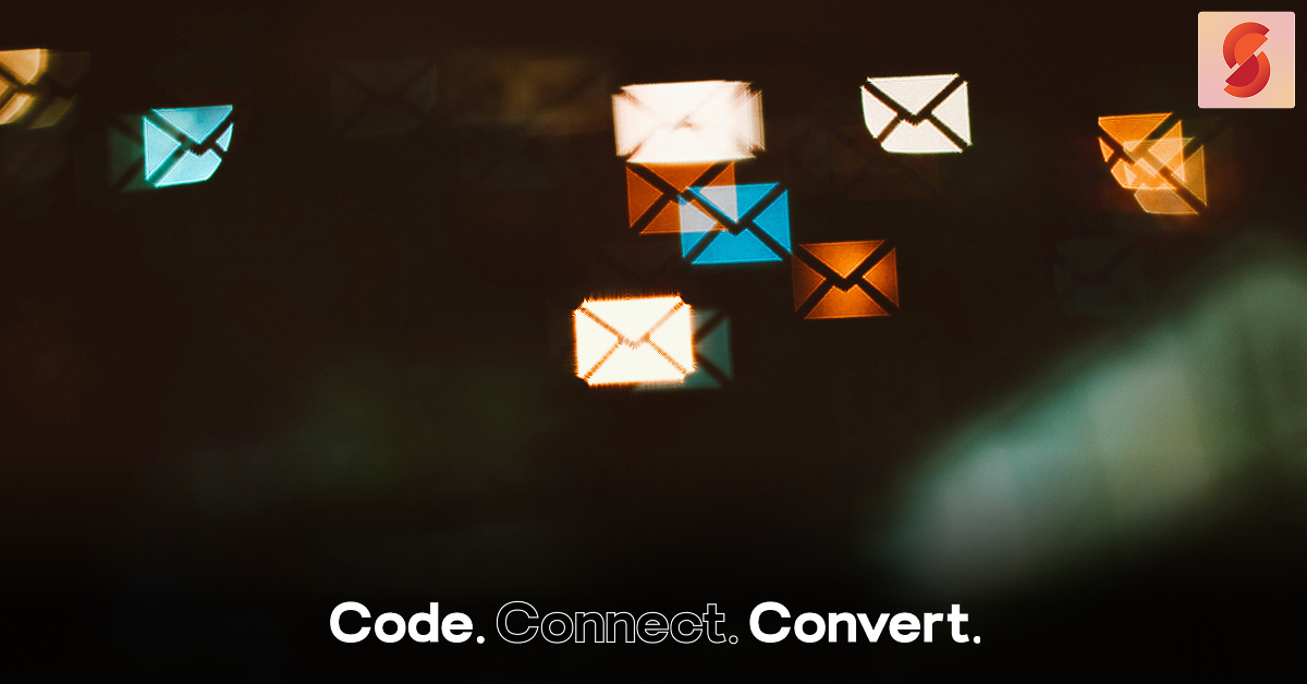 An artistic photo with abstract, glowing bokeh lights shaped like email envelopes in orange and blue against a dark, out-of-focus background.