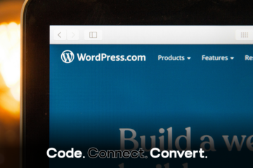 A close-up of a laptop screen displaying the WordPress.com homepage, with its logo and navigation menu visible against a blue background.