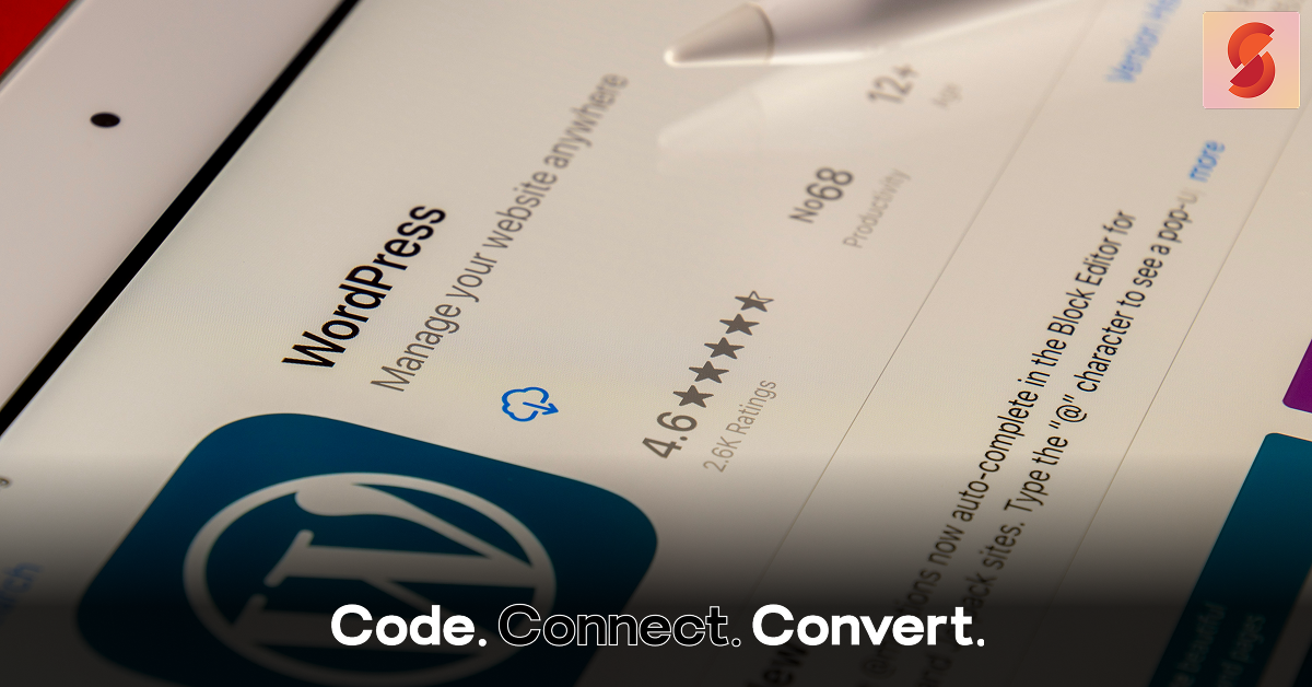 A close-up, angled view of a tablet screen displaying the WordPress app page in an app store, showing its name, logo, and 4.6-star rating.