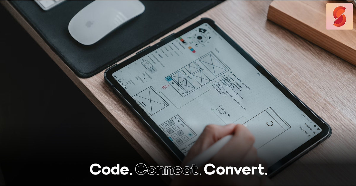 A designer uses a stylus to sketch website wireframes and user flow diagrams directly onto a tablet screen.
