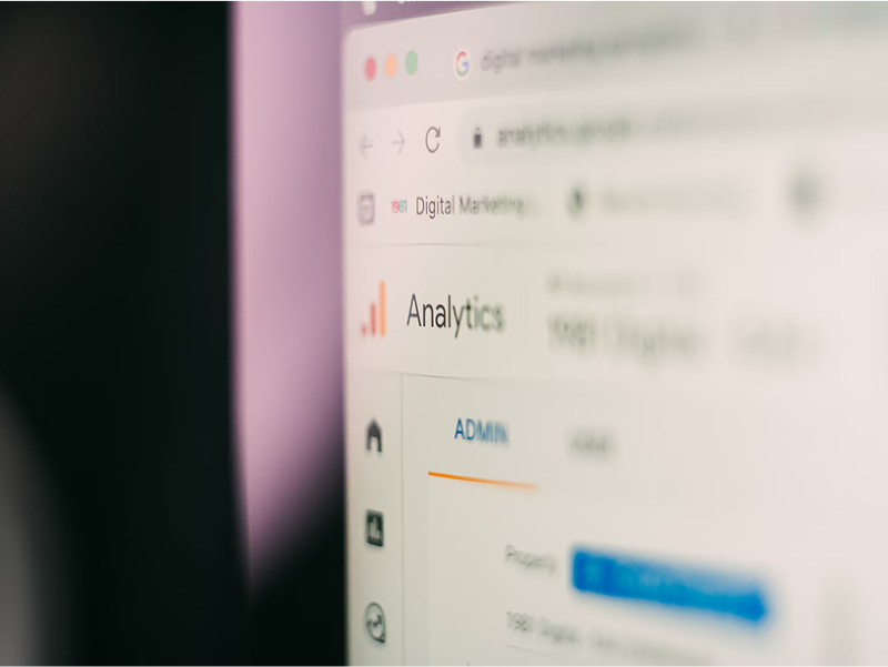 A close-up of a computer screen showing the Google Analytics logo and interface, with the "Analytics" title in sharp focus.