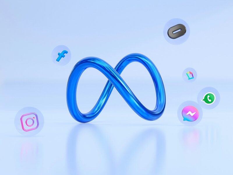 3D blue Meta infinity logo surrounded by Facebook, Instagram, and WhatsApp icons, illustrating the social ecosystem used in Google Ads vs Meta Ads comparisons.